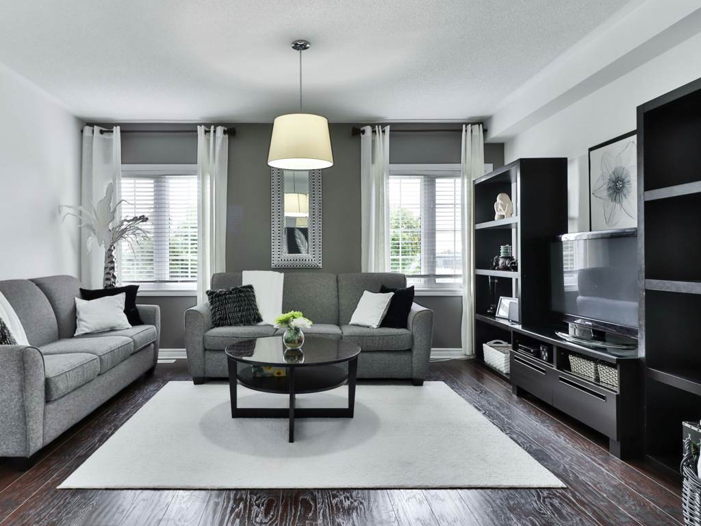 Open-plan loft with concrete columns and layered textiles