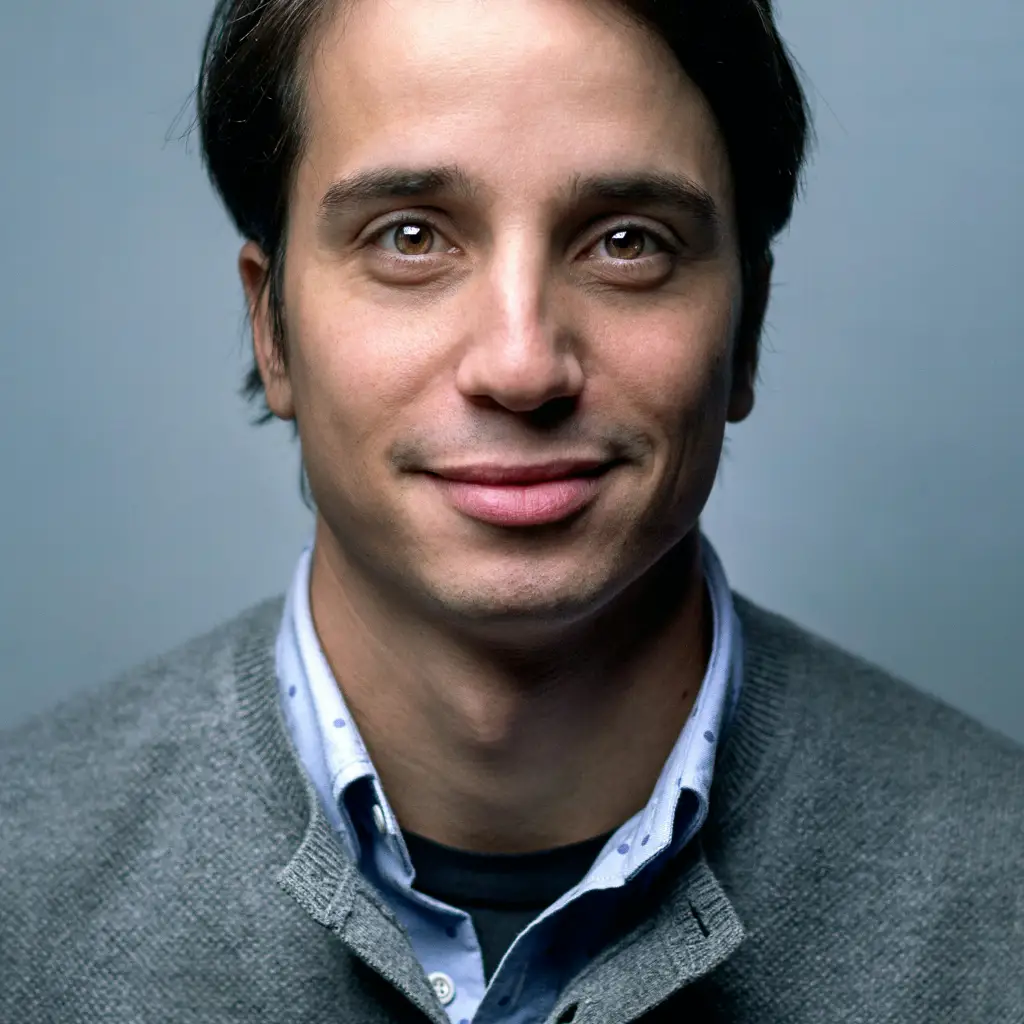 Portrait of a man against a neutral studio background